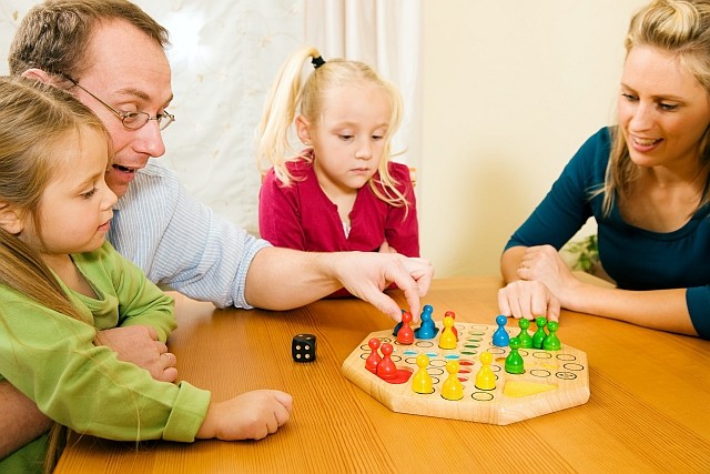 bigstock Family playing board game 6634036